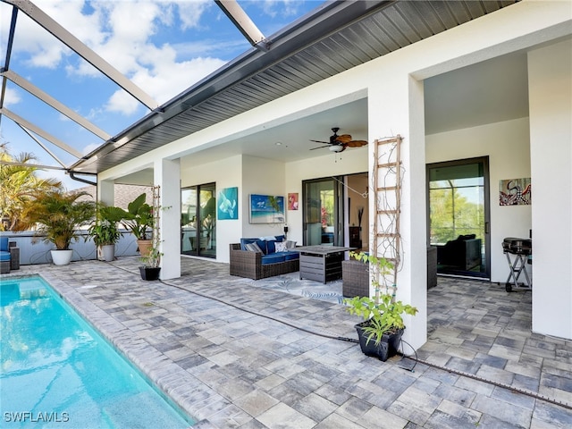 view of patio / terrace featuring ceiling fan, an outdoor living space, and a lanai