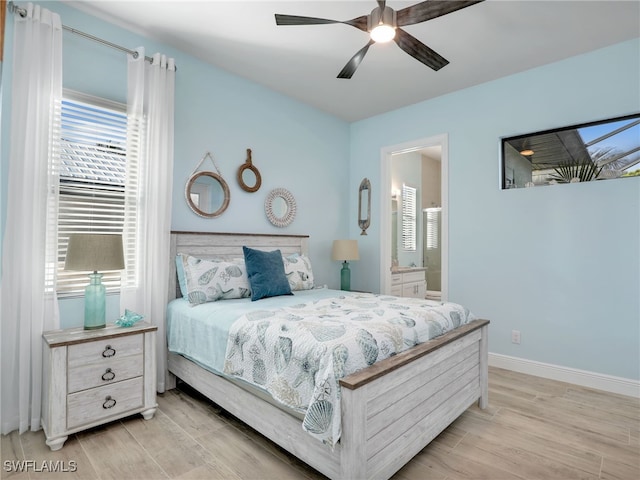 bedroom with connected bathroom and ceiling fan