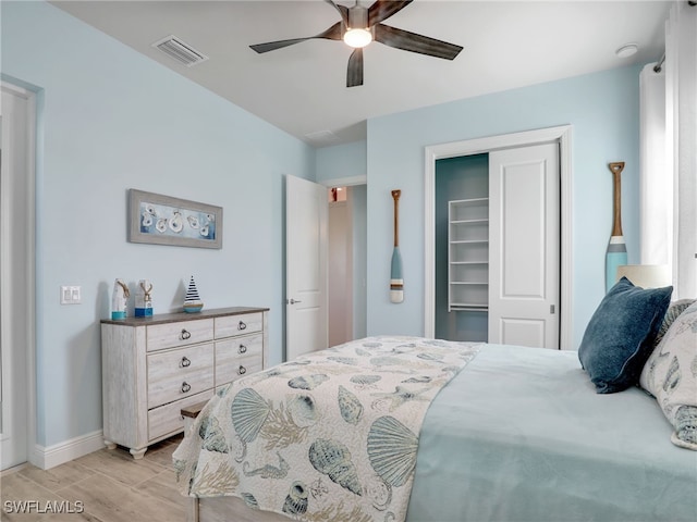 bedroom with ceiling fan and a closet