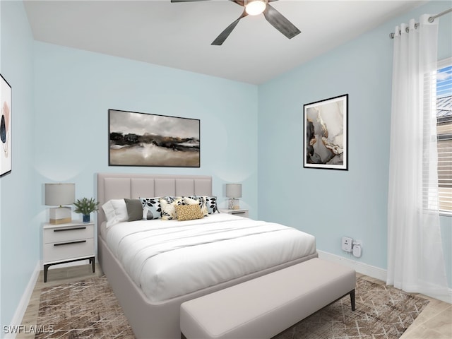 bedroom with light wood-type flooring and ceiling fan