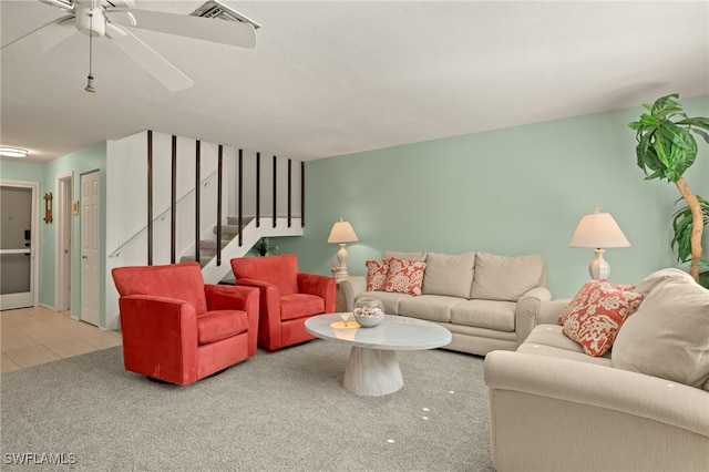 living room featuring tile patterned flooring and ceiling fan