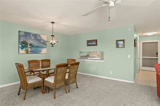 dining room featuring light colored carpet and ceiling fan