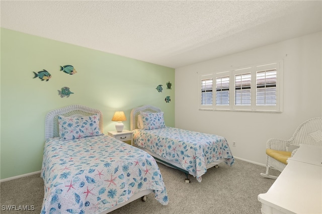 bedroom featuring light carpet and a textured ceiling