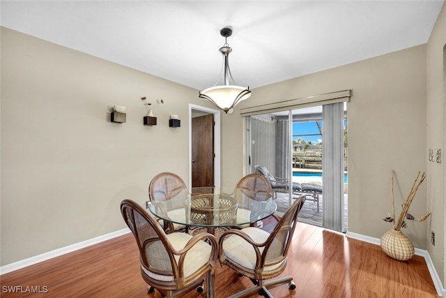 dining area with hardwood / wood-style flooring