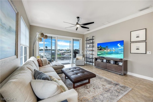 living room with ornamental molding, light tile patterned floors, and ceiling fan