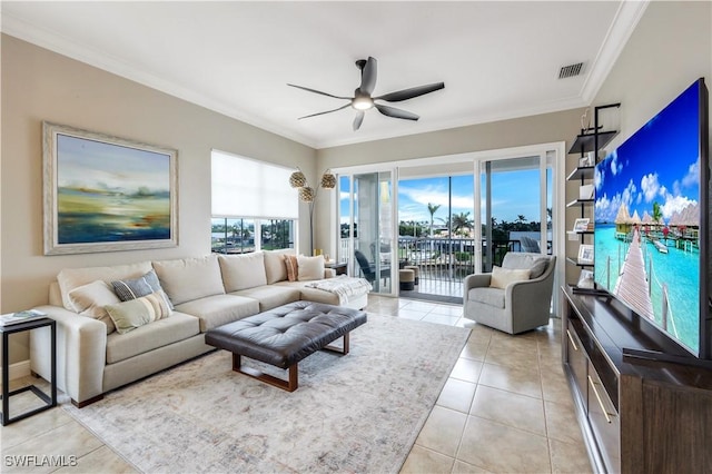 tiled living room with crown molding and ceiling fan