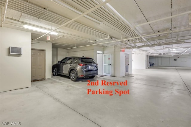 garage featuring an AC wall unit