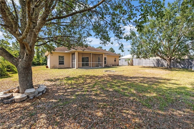 view of yard with a sunroom