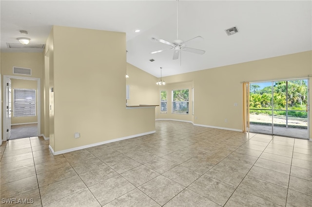 tiled empty room featuring ceiling fan and vaulted ceiling