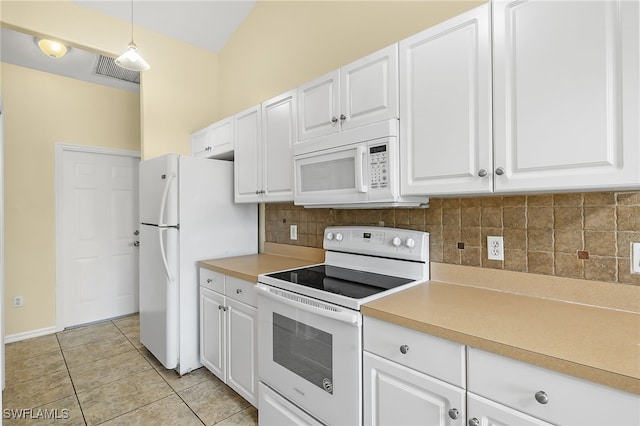 kitchen with pendant lighting, white appliances, tasteful backsplash, white cabinets, and light tile patterned flooring