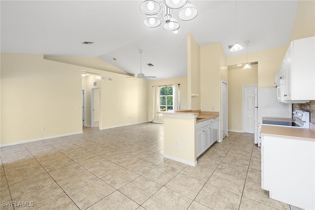 kitchen featuring light tile patterned flooring, white cabinetry, range, vaulted ceiling, and ceiling fan