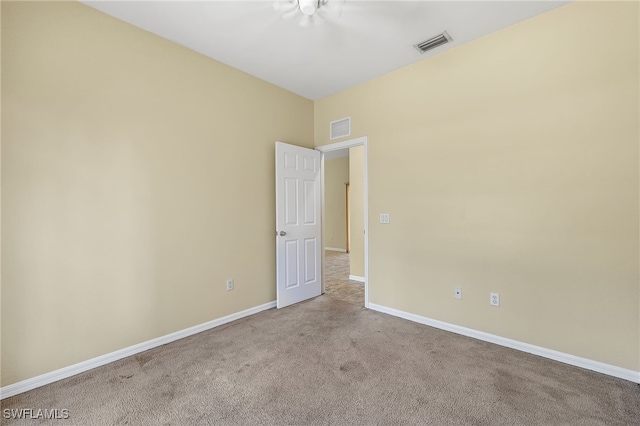 empty room with light colored carpet