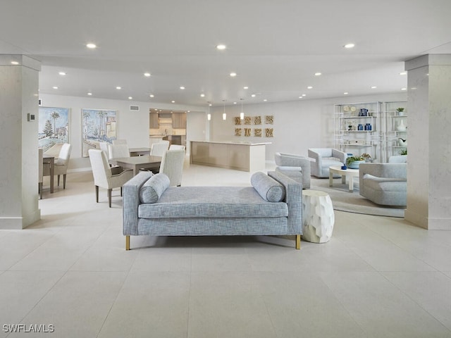 living area with light tile patterned floors, visible vents, baseboards, and recessed lighting