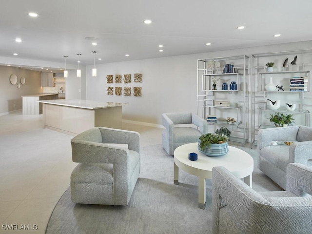 living area featuring light tile patterned floors and recessed lighting