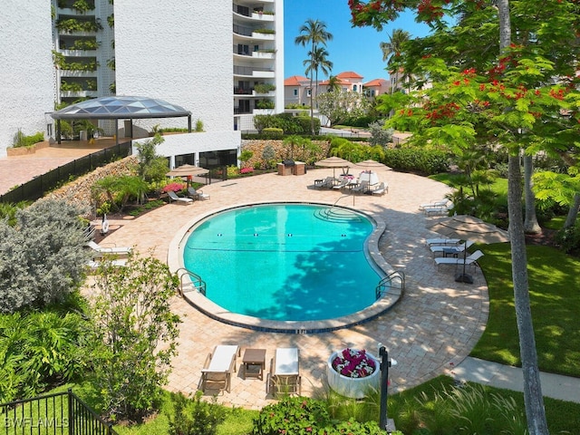 view of pool featuring a lanai and a patio area