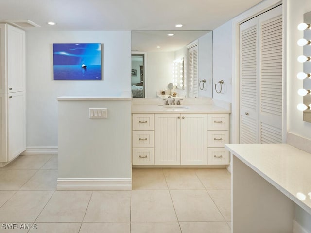 full bath with ensuite bathroom, tile patterned floors, vanity, a closet, and recessed lighting