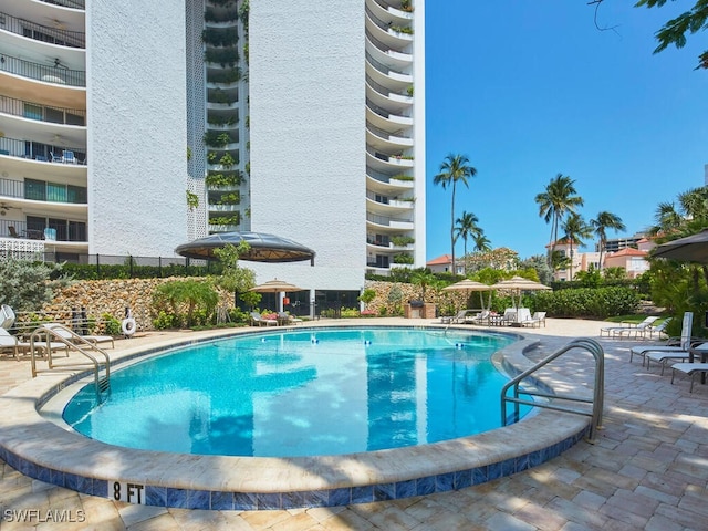 community pool featuring a patio area