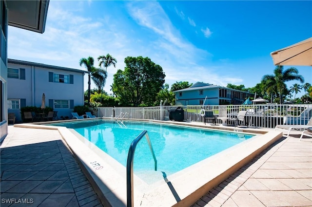 view of pool featuring a patio