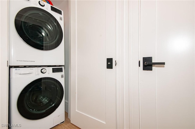 washroom with stacked washer / dryer