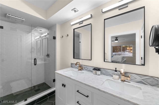 bathroom featuring vanity and an enclosed shower