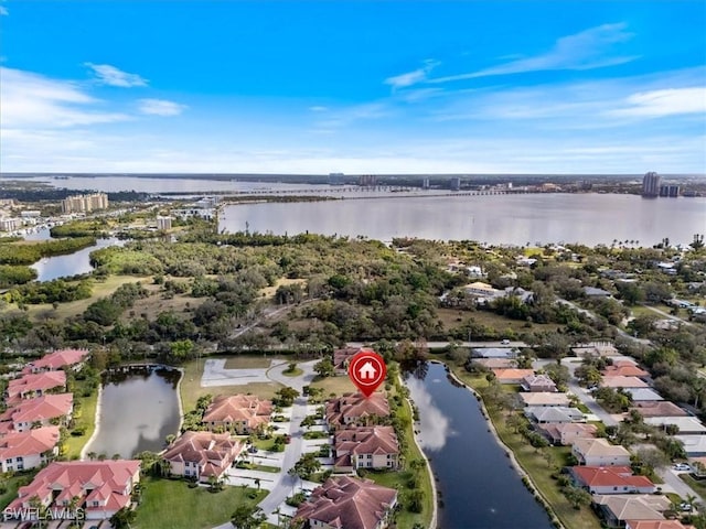 birds eye view of property featuring a water view and a residential view