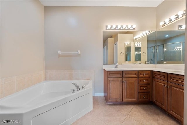 full bathroom with a garden tub, tile patterned flooring, vanity, and a stall shower