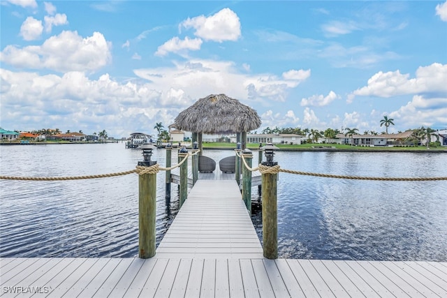 view of dock featuring a gazebo and a water view