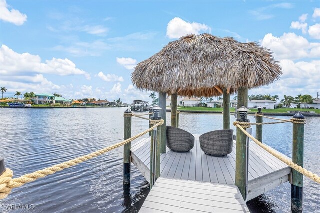 dock area with a gazebo and a water view