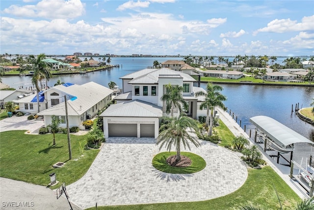 birds eye view of property with a water view