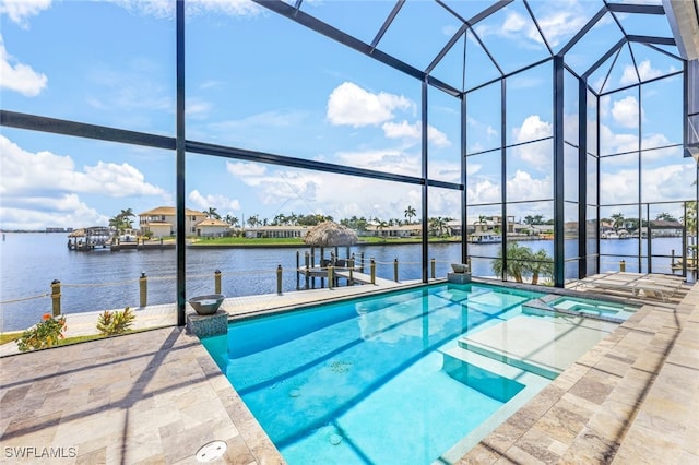 view of swimming pool featuring glass enclosure, a boat dock, and a water view