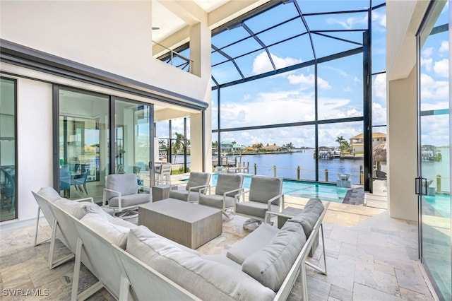 view of patio / terrace with an outdoor living space, a water view, and glass enclosure