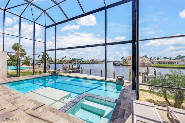 view of pool featuring an in ground hot tub, a water view, a lanai, a patio, and a boat dock