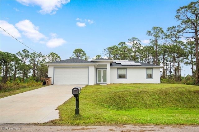 single story home featuring a garage, a front yard, and solar panels