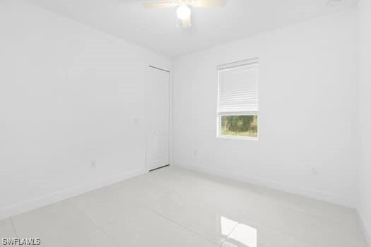 unfurnished room with ceiling fan