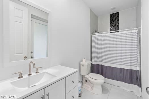 bathroom with vanity, toilet, and a shower with curtain