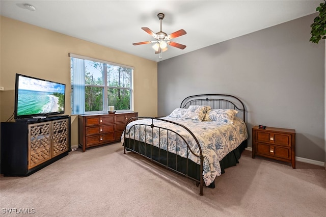 bedroom with baseboards, a ceiling fan, and carpet flooring