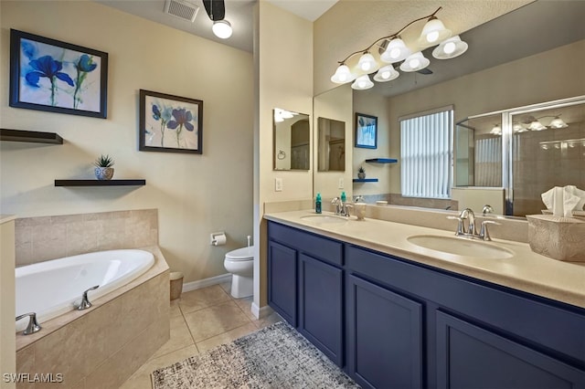 full bath featuring a sink, visible vents, a bath, and tile patterned flooring