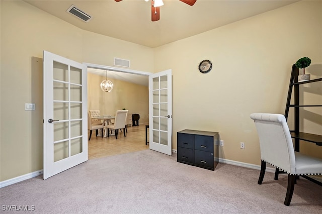 carpeted home office featuring ceiling fan with notable chandelier, french doors, visible vents, and baseboards