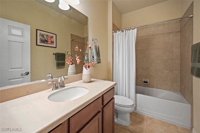 bathroom with tile patterned floors, toilet, vanity, and shower / bath combo