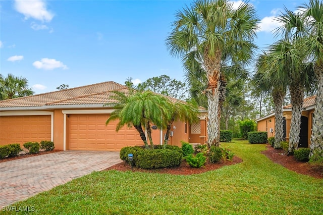 view of side of property with a garage and a yard