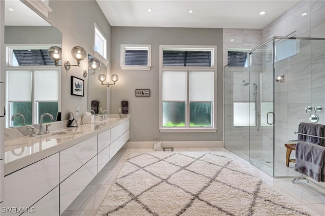 bathroom featuring an enclosed shower and vanity