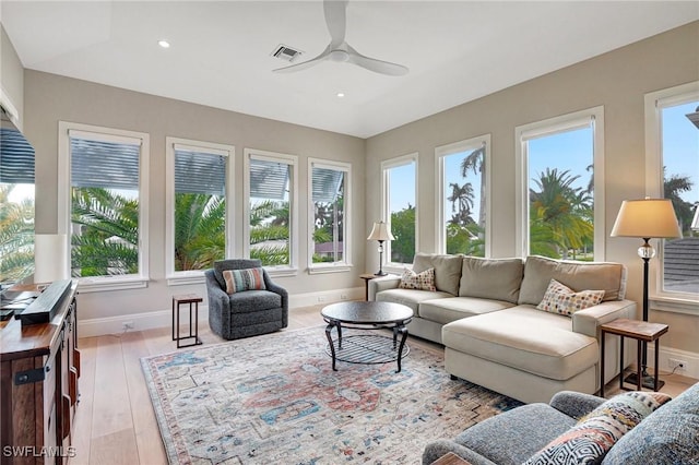 sunroom / solarium with ceiling fan