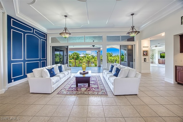 living room with light tile patterned floors, ornamental molding, and ceiling fan