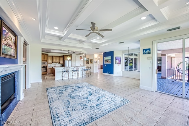 tiled living room featuring crown molding, coffered ceiling, and beam ceiling