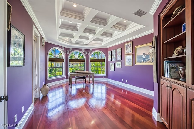 interior space featuring coffered ceiling, ornamental molding, and beam ceiling