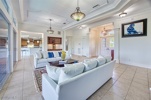 living room featuring crown molding, plenty of natural light, and light tile patterned floors