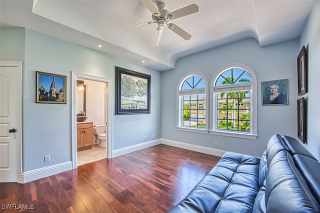 living room with dark hardwood / wood-style floors and ceiling fan