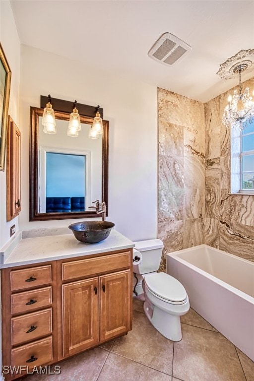 full bathroom featuring vanity, a notable chandelier, tile patterned flooring, and toilet