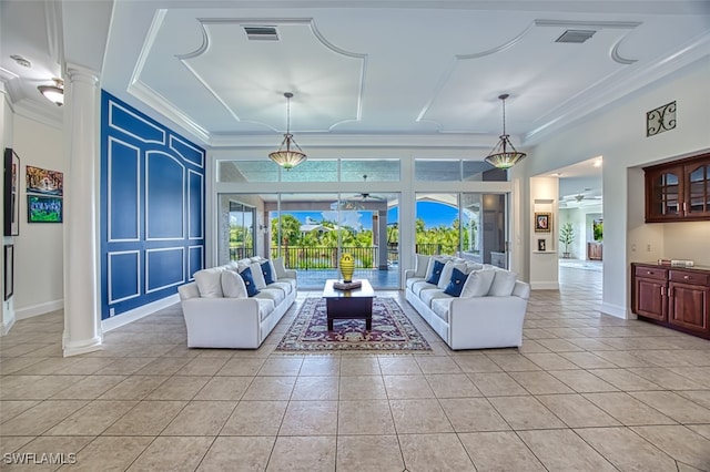 living room featuring ornate columns, crown molding, and light tile patterned floors