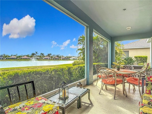 sunroom with a water view